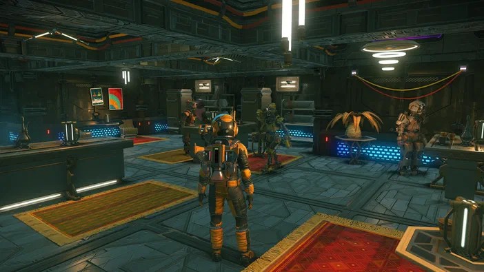 Capture d'écran du jeu vidéo No Man's Sky montrant un vaisseau spatial dans une base futuriste avec des personnages en armure.