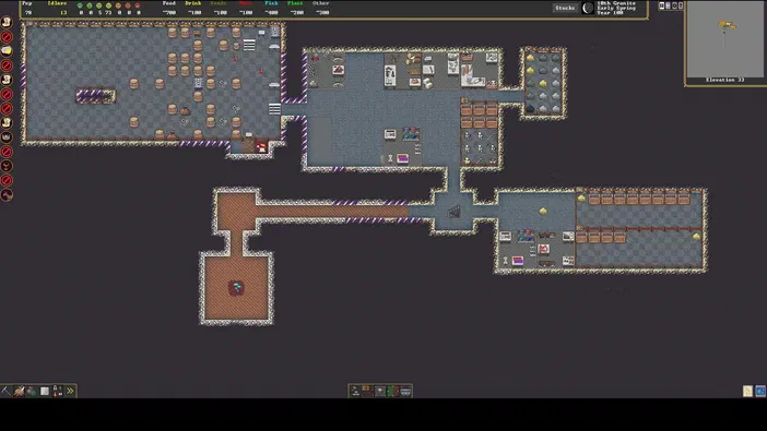 Capture d'écran de Dwarf Fortress montrant une vue en plan d'une base souterraine avec des pièces et du matériel disposés sur un sol gris.