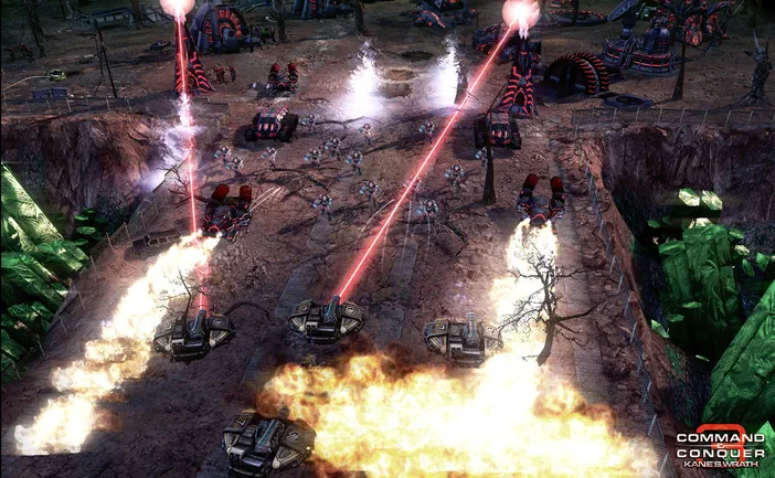 Capture d'écran du jeu vidéo Command & Conquer 3: Kane's Wrath montrant une bataille avec des lasers rouges et des explosions sur un terrain accidenté.