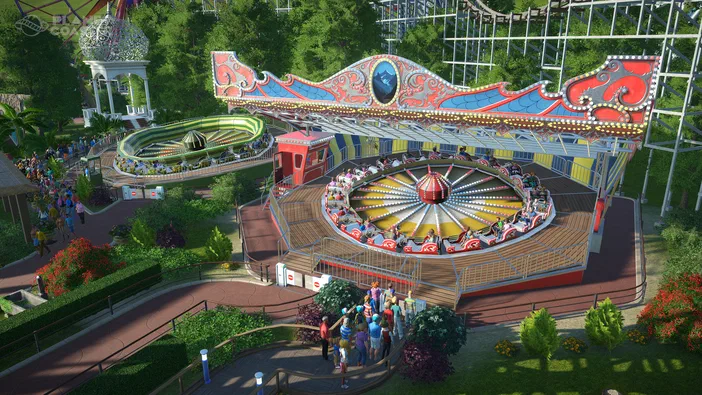 Vue d'un parc de divertissement virtuel dans le jeu Planet Coaster, montrant une grande attraction en rotation avec des passagers et un manège vert à proximité.