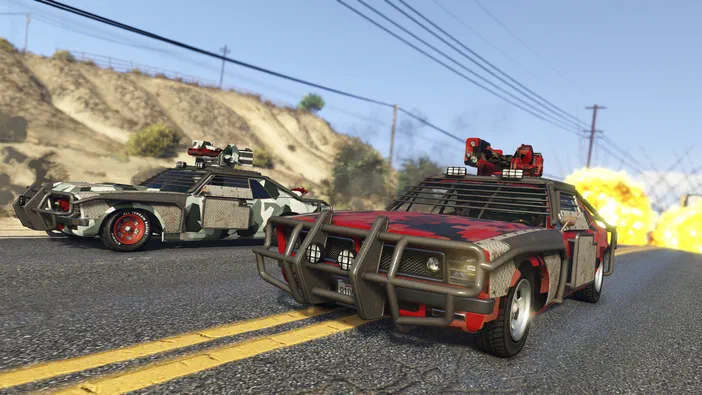 Deux voitures modifiées avec des canons sur le toit, stationnées sur une route ensoleillée dans Grand Theft Auto V Legacy.