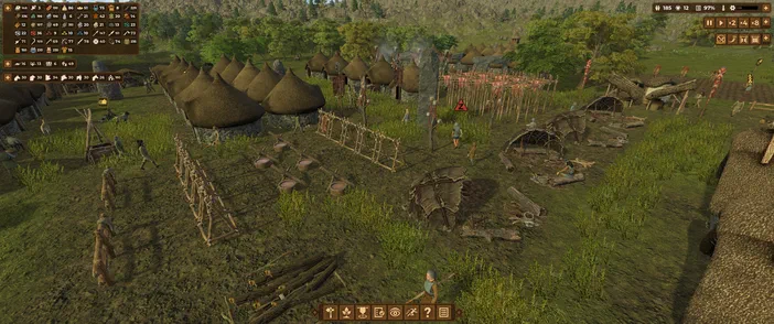 Vue d'un village paléolithique dans le jeu Dawn of Man avec des huttes coniques et des personnages en activité.
