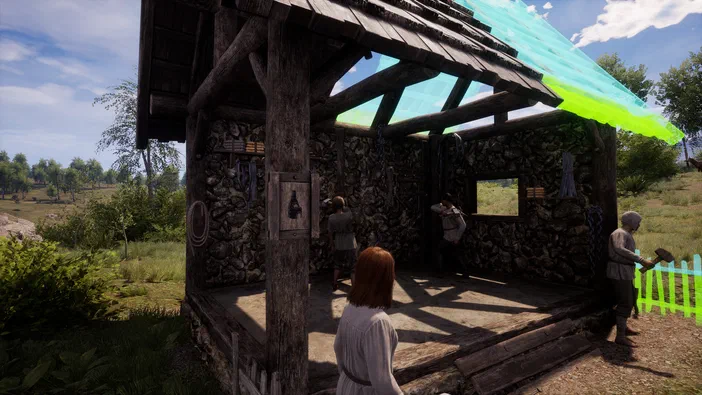 Dans le jeu vidéo Medieval Dynasty, une femme aux cheveux roux observe un bâtiment en bois et pierre où plusieurs personnages sont occupés à des tâches domestiques sous un toit partiellement transparent.