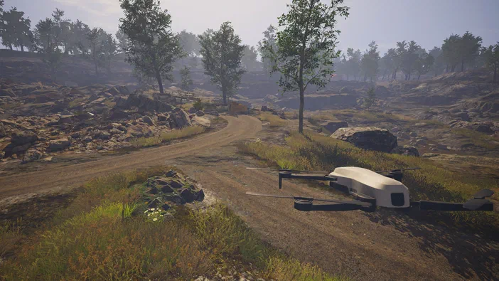 Dans le jeu vidéo Dinosaur Fossil Hunter, un drone blanc repose sur une route de terre dans un paysage rocheux et boisé.