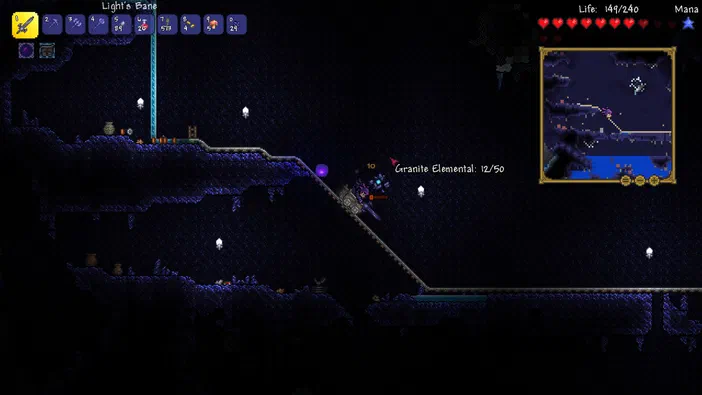 Capture d'écran du jeu Terraria montrant un personnage affrontant une Granite Elemental dans le monde souterrain.