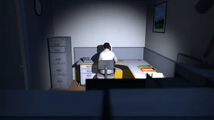 Dans The Stanley Parable, un personnage est assis dos à la caméra dans son bureau.