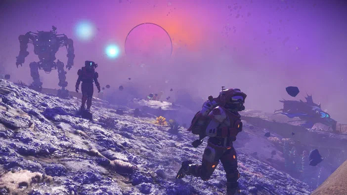 Capture d'écran du jeu vidéo No Man's Sky montrant des explorateurs en combinaison spatiale sur un paysage extraterrestre violet avec une structure géante et des astéroïdes.