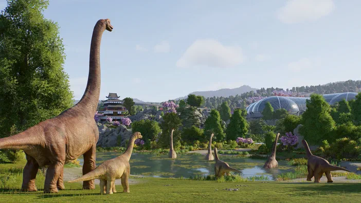 Capture d'écran de Jurassic World Evolution 3 montrant un parc avec plusieurs dinosaures brachiosaures dans une prairie verdoyante.