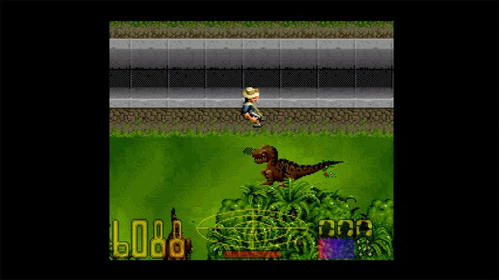 Capture d'écran du jeu Jurassic Park Classic Games Collection montrant un dinosaure T-Rex sur une colline verte avec un personnage en arrière-plan.