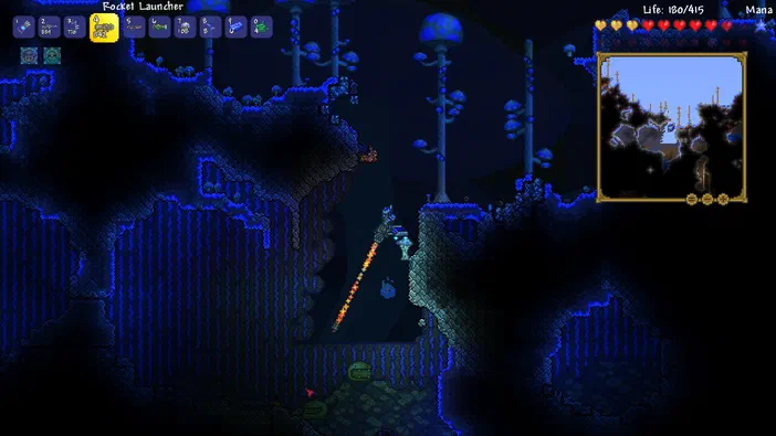 Capture d'écran du jeu Terraria montrant un personnage utilisant une arme à feu dans un environnement souterrain sombre avec des éléments de l'interface utilisateur.