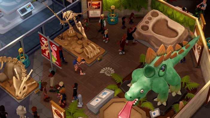 Vue d'un musée animé du jeu Two Point Museum avec des squelettes de dinosaures, un T-Rex vert et divers visiteurs.