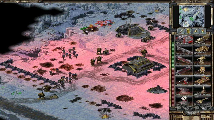 Capture d'écran du jeu de stratégie Command & Conquer Tiberian Sun montrant une base GDI avec des bâtiments et troupes sur un terrain rose, accompagnée de l'interface utilisateur.