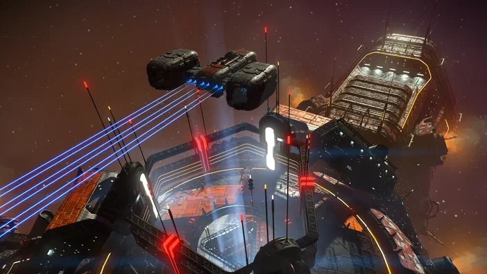 Dans l'univers de No Man's Sky, une station spatiale complexe est entourée d'engins volants émettant des faisceaux laser bleus sous un ciel étoilé.