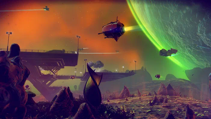 Capture d'écran du jeu vidéo No Man's Sky montrant une planète aux couleurs vives avec des vaisseaux spatiaux et des structures futuristes.