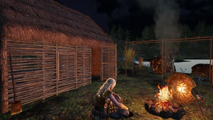 Dans le jeu vidéo Survisland, un personnage est assis près d'un feu de camp devant une cabane en bois et paille.