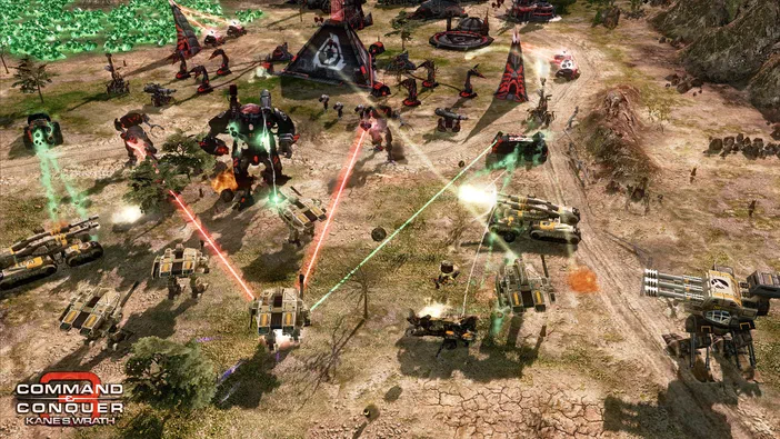 Capture de jeu vidéo Command & Conquer 3: Kane's Wrath montrant une bataille avec des véhicules et structures tirant sur un géant mécanique.
