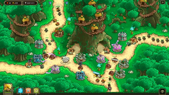 Capture d'écran du jeu Kingdom Rush Origins montrant une carte de stratégie avec des tours et ennemis dans un décor forestier.