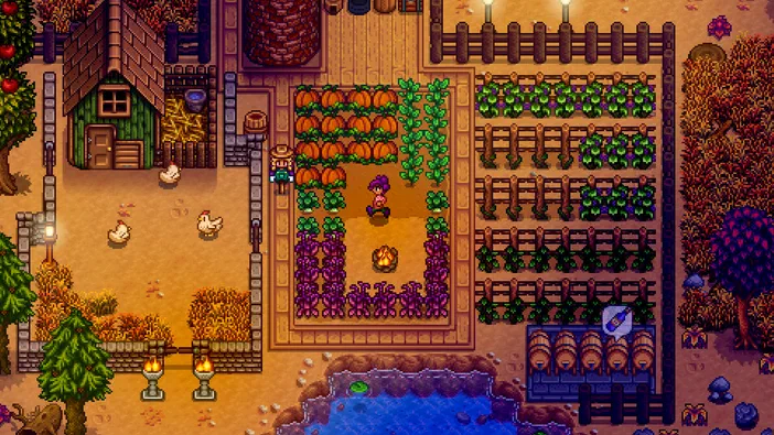 Dans Stardew Valley, un joueur cultive des citrouilles et d'autres légumes dans son champ pendant l'automne.