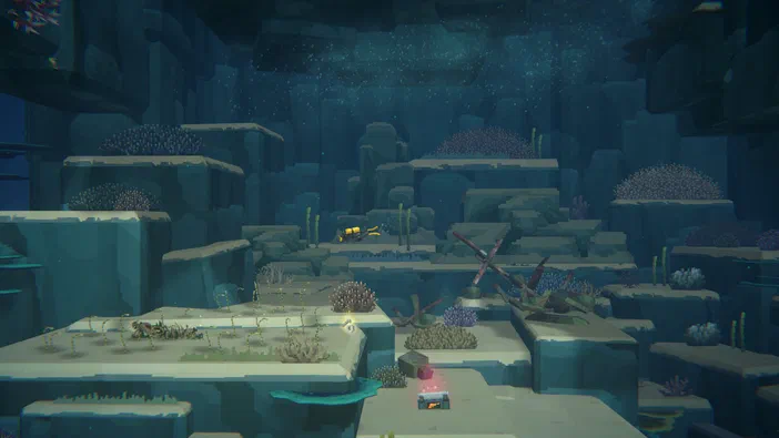Capture d'écran du jeu vidéo Dave the Diver montrant un personnage plongeant dans une grotte sous-marine parsemée de coraux et de rochers.