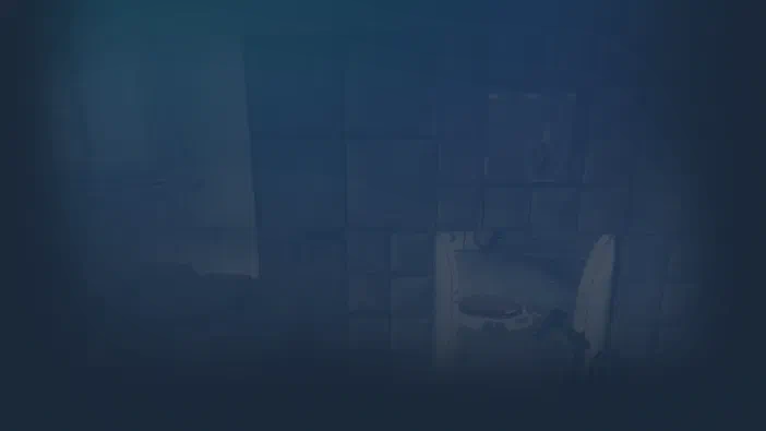 Fond d'écran du jeu vidéo Portal montrant une salle aux murs carrelés bleus avec un appareil scientifique blanc au centre.