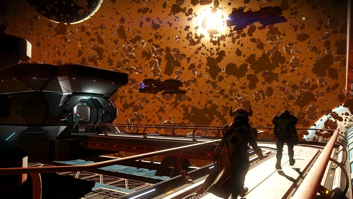 Capture d'écran du jeu vidéo No Man's Sky montrant deux personnages en armure sur une plateforme flottante au milieu d'un champ d'astéroïdes sous un soleil brillant.