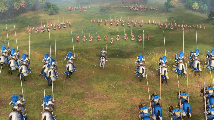 Capture de jeu vidéo d'Age of Empires IV montrant une bataille médiévale avec des troupes en formation sur un champ.