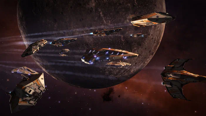 Une flotte de vaisseaux spatiaux survole une planète dans le jeu vidéo Elite Dangerous.